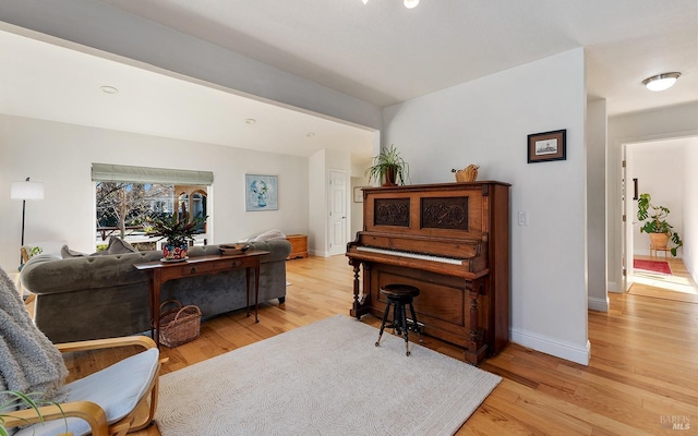 living area with light hardwood / wood-style flooring