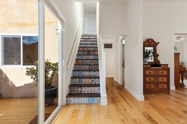 staircase featuring hardwood / wood-style floors