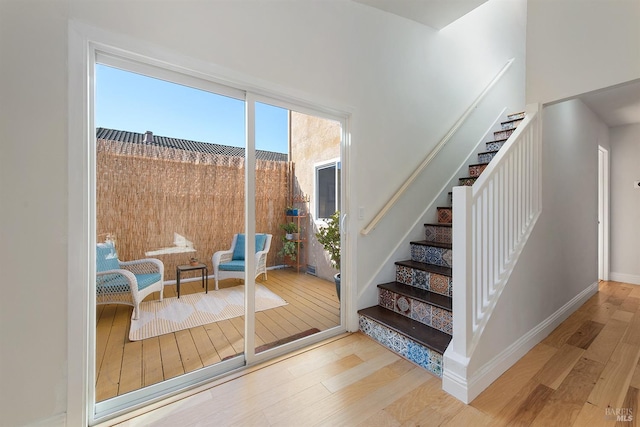 doorway to outside with wood-type flooring