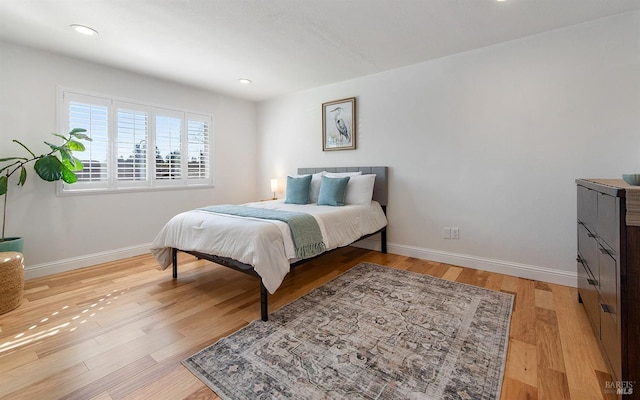 bedroom with light hardwood / wood-style floors