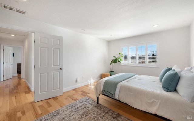 bedroom with light wood-type flooring