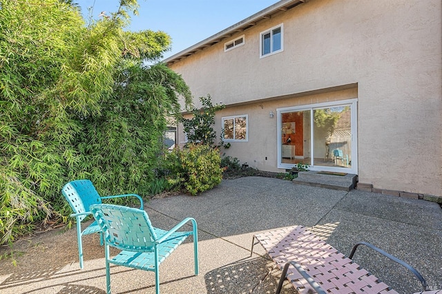 rear view of house with a patio