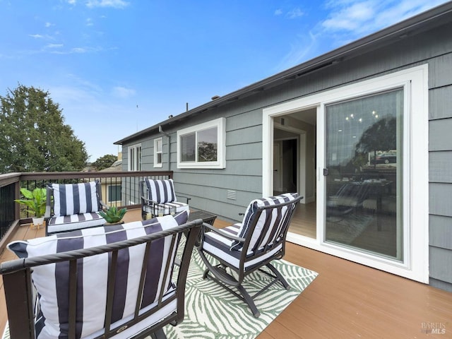 deck featuring outdoor lounge area