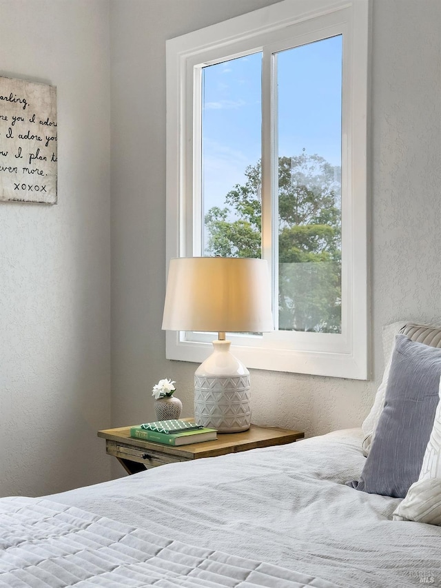 bedroom with a textured wall
