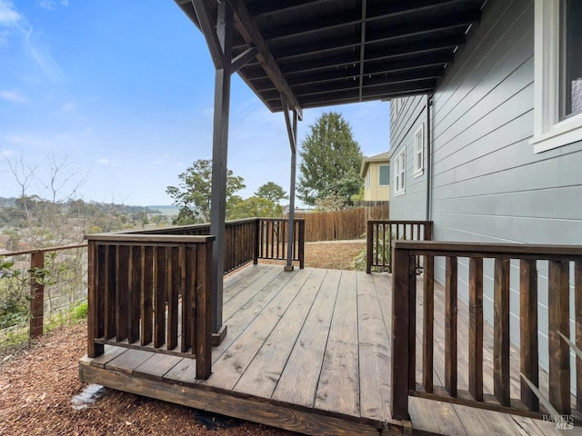 wooden deck featuring fence