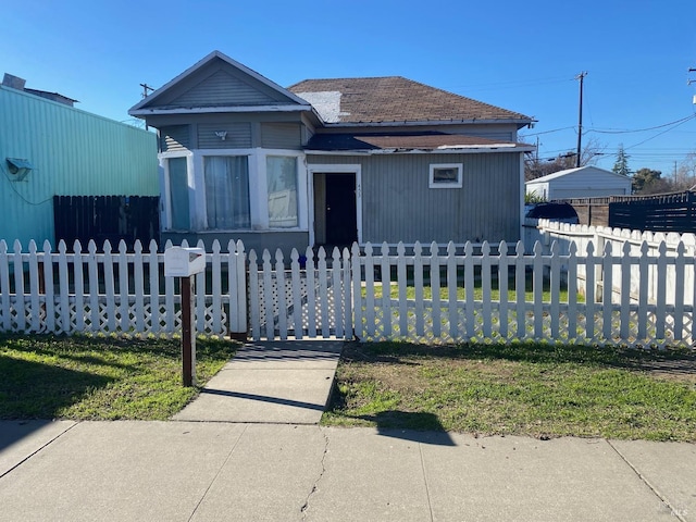 bungalow-style house featuring a front yard