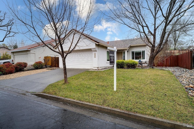 single story home featuring a garage and a front yard