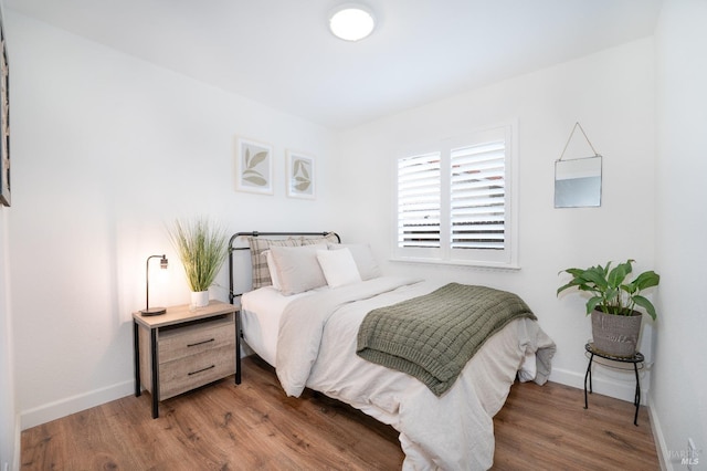 bedroom featuring hardwood / wood-style flooring