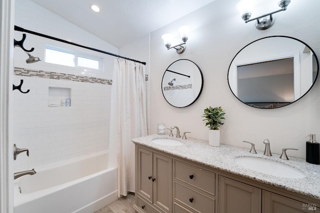 bathroom featuring vanity, lofted ceiling, and shower / bathtub combination with curtain