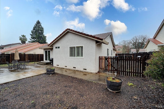 back of house with a patio area