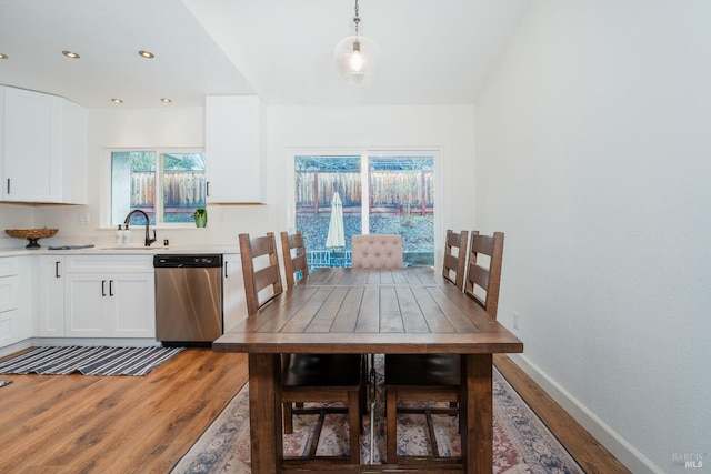 dining area featuring hardwood / wood-style flooring and sink