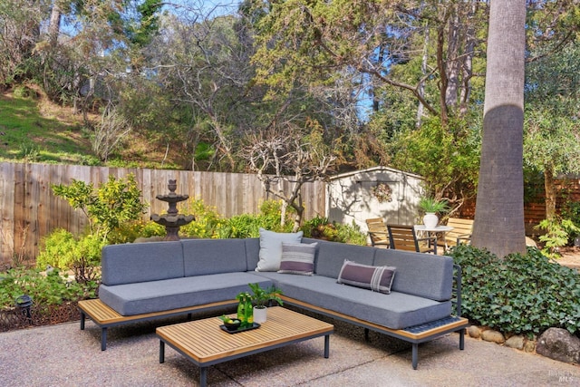 view of patio / terrace featuring outdoor lounge area and a shed