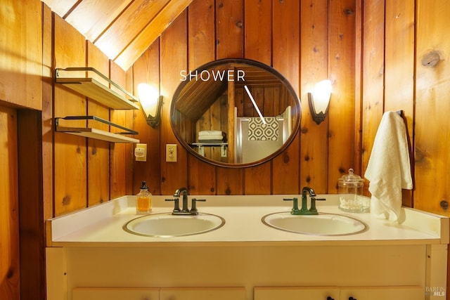 bathroom featuring vanity and wooden walls