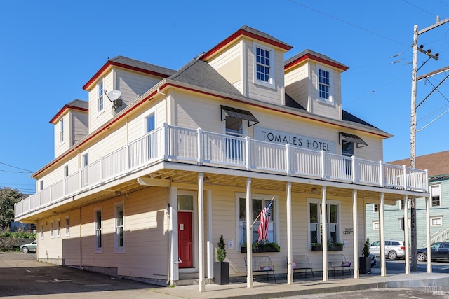 view of front of home with a balcony