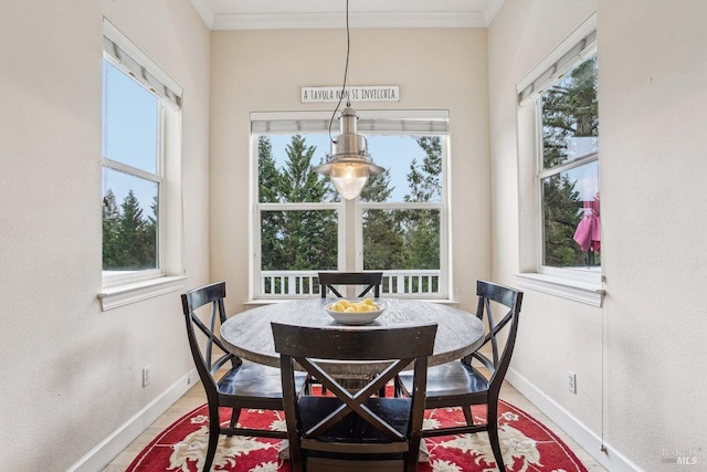 dining room featuring crown molding