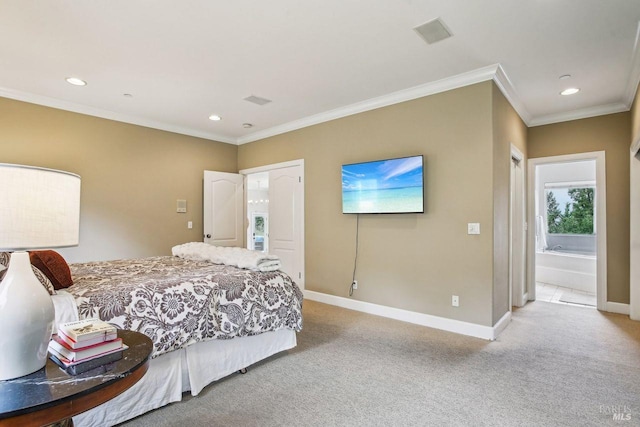 bedroom featuring crown molding, light colored carpet, and ensuite bathroom