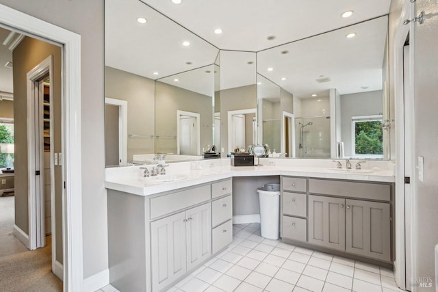 bathroom with vanity, an enclosed shower, and tile patterned floors