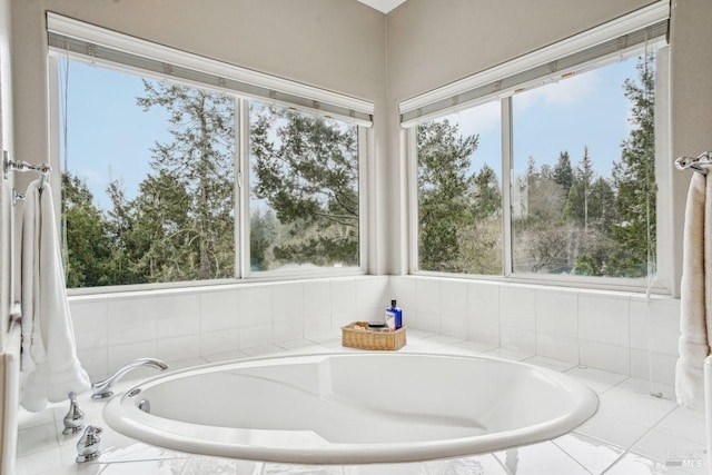 bathroom featuring a relaxing tiled tub