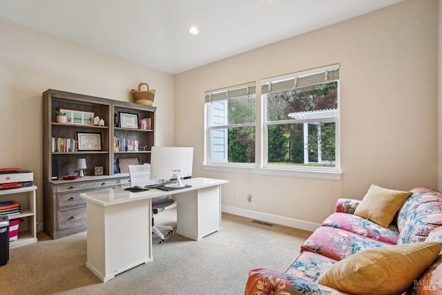 office area featuring light colored carpet