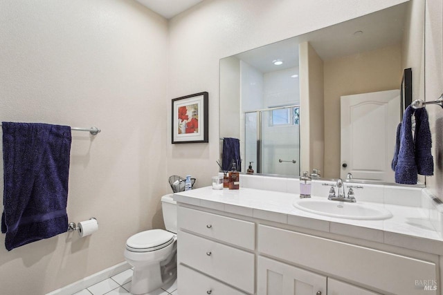 bathroom featuring vanity, tile patterned floors, toilet, and walk in shower