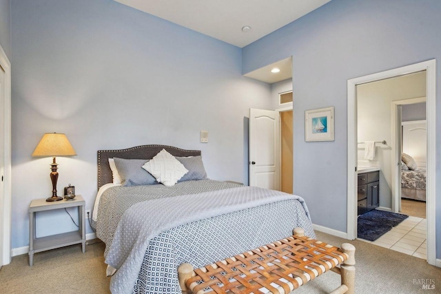 carpeted bedroom with ensuite bathroom