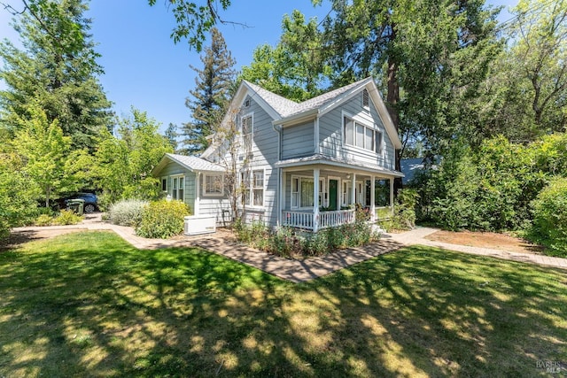 exterior space featuring a yard and covered porch