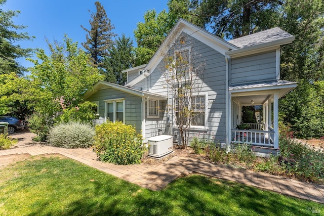 view of front of property with a front yard and a porch