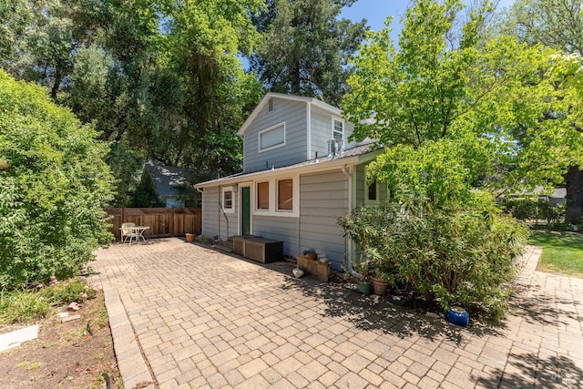 back of property with a patio