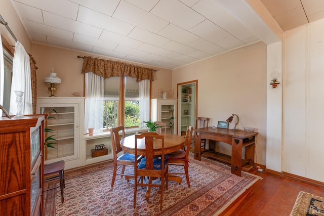 dining space featuring wood-type flooring