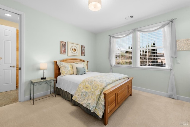 bedroom featuring light colored carpet