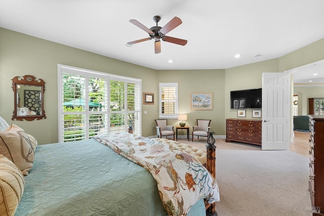 bedroom with light carpet and ceiling fan