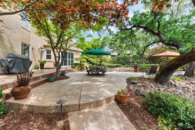 view of patio featuring a grill