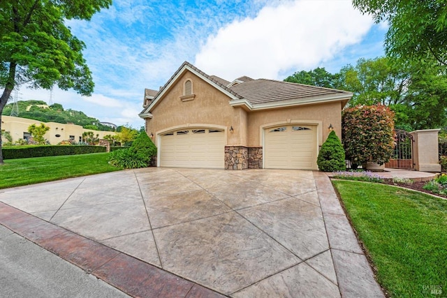 view of front of house with a garage and a front yard