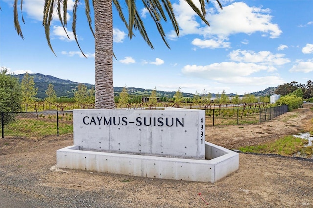 community sign featuring a rural view and a mountain view