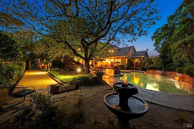 view of patio terrace at dusk