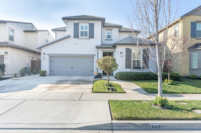 view of front of home featuring an attached garage, stucco siding, concrete driveway, a front lawn, and a tiled roof