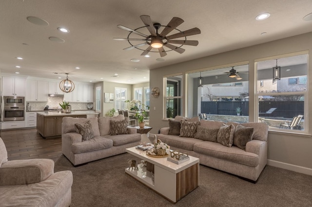 living room featuring recessed lighting, baseboards, ceiling fan, and dark colored carpet