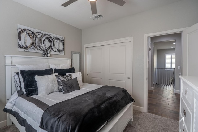 bedroom featuring wood-type flooring, a closet, and ceiling fan