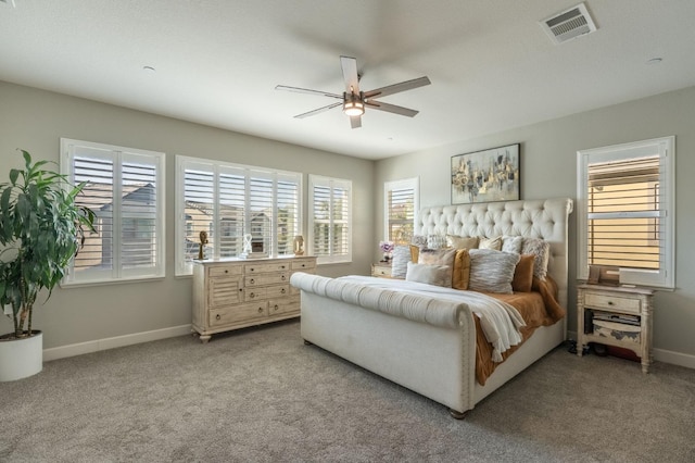 bedroom featuring baseboards, light carpet, a ceiling fan, and visible vents