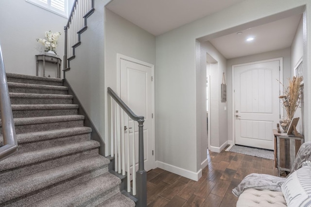 stairway with hardwood / wood-style flooring