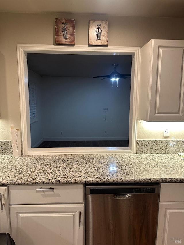 interior details featuring white cabinetry, stainless steel dishwasher, light stone countertops, and ceiling fan