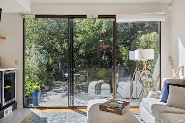 doorway to outside with beverage cooler