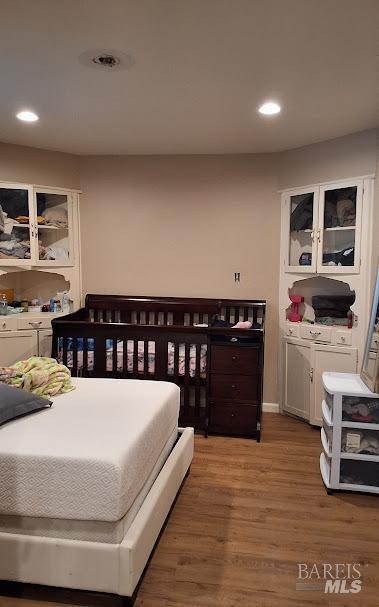 bedroom featuring dark wood-type flooring