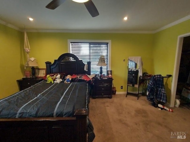 carpeted bedroom featuring crown molding and ceiling fan