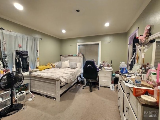 carpeted bedroom with crown molding