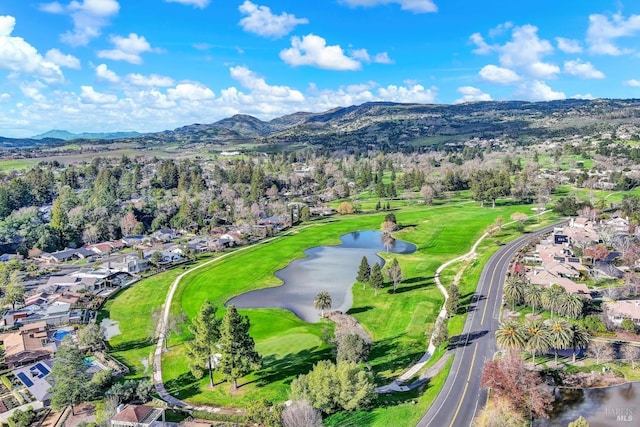 bird's eye view with a water and mountain view