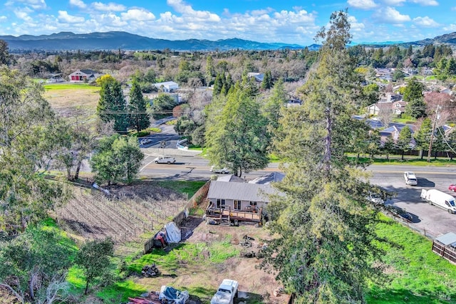 birds eye view of property with a mountain view