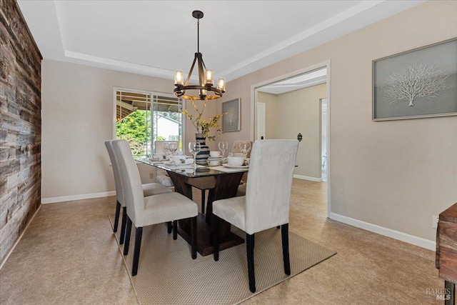 dining space featuring a notable chandelier