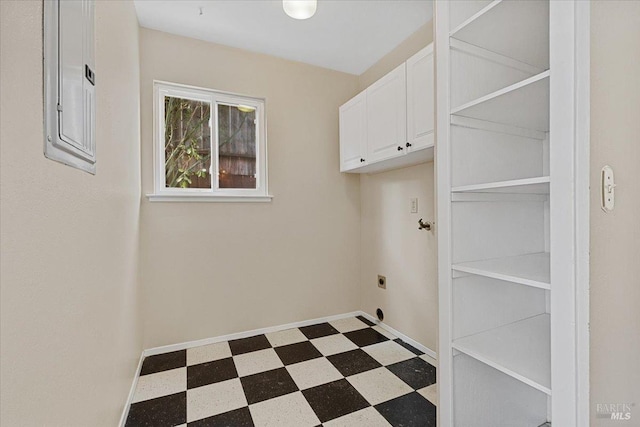 clothes washing area featuring cabinets, electric panel, and electric dryer hookup