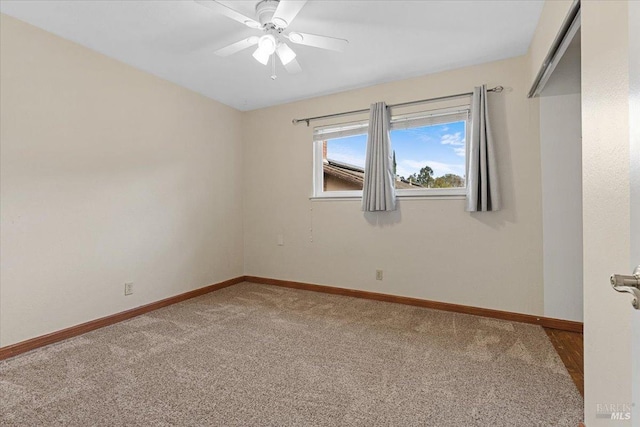 carpeted empty room featuring ceiling fan